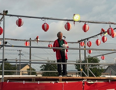 夏まつりの開会式で挨拶する弥永西校区自治協議会大重会長